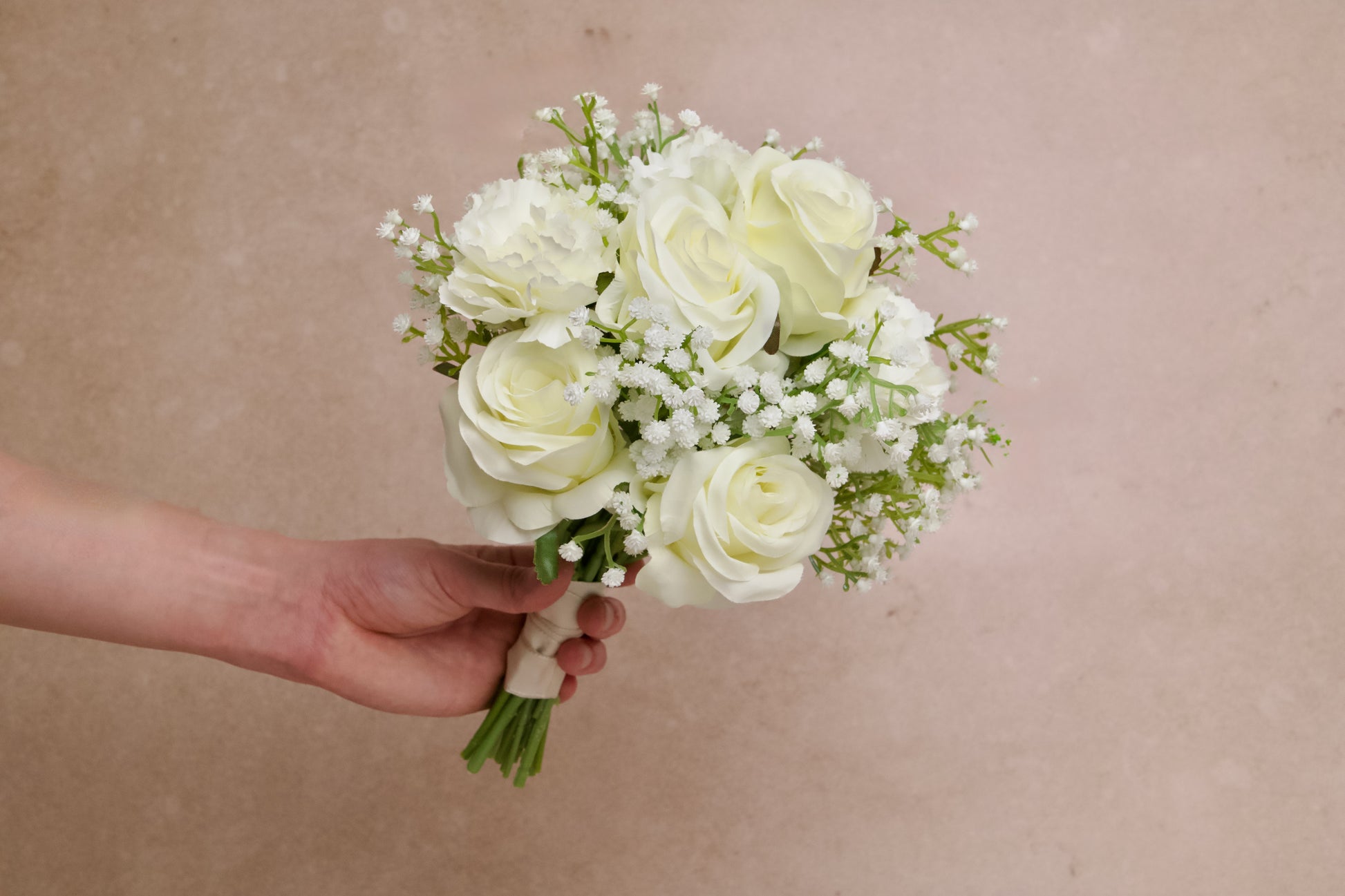 Bridal bouquet made of white roses, carnations and babys breath for wedding rental