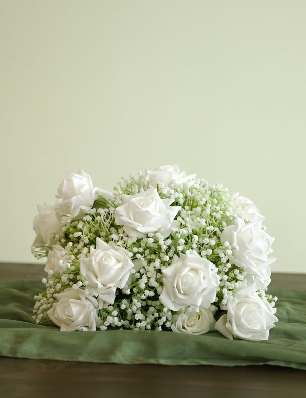 Wedding table decoration made of real-touch white roses and babys breath